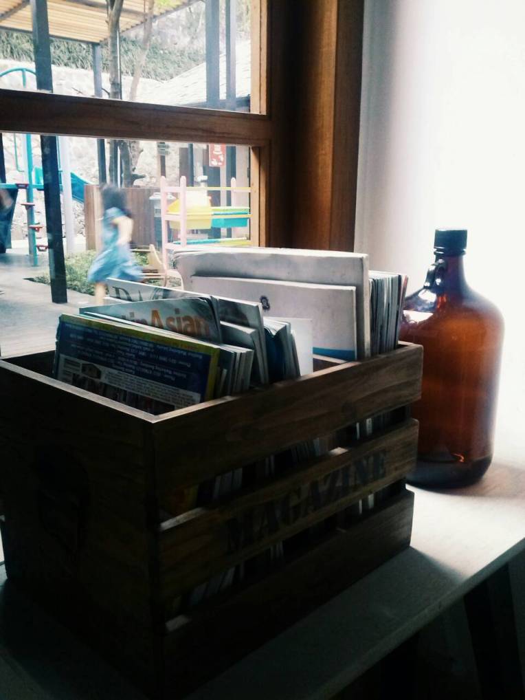 Books and bottle by the window